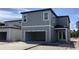 New two-story home featuring a large front-facing garage and concrete driveway at 2467 Zuni Road, St Cloud, FL 34771
