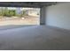 Open garage with an in-view of the street and surrounding landscape at 2467 Zuni Road, St Cloud, FL 34771