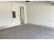 Spacious garage with concrete floor and access door to the house at 2467 Zuni Road, St Cloud, FL 34771