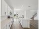 Bright kitchen featuring stainless appliances, white cabinets, and an island overlooking the backyard at 2467 Zuni Road, St Cloud, FL 34771