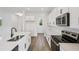 Stylish kitchen features white cabinets, stainless appliances, and a center island at 2467 Zuni Road, St Cloud, FL 34771