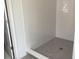 Modern bathroom featuring tiled shower and neutral finishes at 2467 Zuni Road, St Cloud, FL 34771