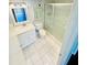Bathroom features a white vanity, framed mirror, toilet, and shower with sliding glass doors at 248 Crown Oaks Way, Longwood, FL 32779