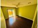 This bedroom includes a sliding glass door to a personal patio, ceiling fan and hardwood floors at 248 Crown Oaks Way, Longwood, FL 32779