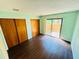 This bedroom shows hardwood floors, lots of closet space and a sliding door to the back patio at 248 Crown Oaks Way, Longwood, FL 32779