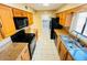 A kitchen with appliances and beautiful granite countertops has been updated for modern living at 248 Crown Oaks Way, Longwood, FL 32779