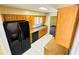 The kitchen features black appliances, tile flooring, updated cabinets and beautiful granite countertops at 248 Crown Oaks Way, Longwood, FL 32779