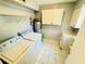 A laundry room features a washer, dryer, cabinets and tile floors at 248 Crown Oaks Way, Longwood, FL 32779