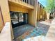 A covered patio with sliding glass doors and stepping stones in the mulch at 248 Crown Oaks Way, Longwood, FL 32779