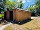 A storage building with double doors on the side of the property at 248 Crown Oaks Way, Longwood, FL 32779
