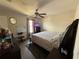 Bedroom featuring a ceiling fan and window with natural light at 2530 Baykal Dr, Kissimmee, FL 34746