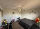 Bedroom featuring ceiling fan, decor, and double door closet at 2530 Baykal Dr, Kissimmee, FL 34746