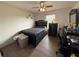 Comfortable bedroom with work space, complemented by a ceiling fan at 2530 Baykal Dr, Kissimmee, FL 34746
