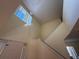 Bright and spacious foyer with staircase and a large window, providing plenty of natural light at 2530 Baykal Dr, Kissimmee, FL 34746