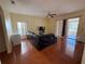 Living room featuring tile floors, a ceiling fan, and sliding doors leading to the outdoor area at 2530 Baykal Dr, Kissimmee, FL 34746