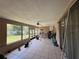 Enclosed patio featuring tile floor, ceiling fan, and a view of the backyard at 2530 Baykal Dr, Kissimmee, FL 34746