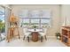 Cozy breakfast nook features bright light, comfortable seating, and an easel for the inspired artist at 2766 Purple Meadow Ct, Minneola, FL 34715