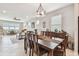 Open-concept living space featuring a dining area with elegant chandelier lighting at 2766 Purple Meadow Ct, Minneola, FL 34715