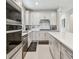 Well-equipped kitchen featuring stainless steel appliances and sleek, modern countertops at 2766 Purple Meadow Ct, Minneola, FL 34715