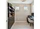 Functional home office with a built-in bookshelf, a comfortable desk area, and natural light at 2766 Purple Meadow Ct, Minneola, FL 34715