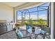 Inviting outdoor patio with comfortable seating, a grill, and stunning views of the surrounding landscape at 2766 Purple Meadow Ct, Minneola, FL 34715
