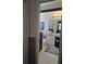 Bathroom view featuring blue and white cabinets, tile floor, and tub at 2863 Middleton Cir, Kissimmee, FL 34743