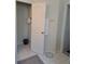 Neutral bathroom featuring a walk in closet, tile flooring, and a white door at 2863 Middleton Cir, Kissimmee, FL 34743