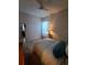 Cozy bedroom featuring a ceiling fan, patterned bedding, and a closet at 2863 Middleton Cir, Kissimmee, FL 34743