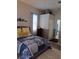 Inviting bedroom with a cozy bed, soft lighting, and convenient closet space at 2863 Middleton Cir, Kissimmee, FL 34743