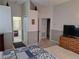 A well-lit bedroom featuring calming paint, carpeting, and bathroom access at 2863 Middleton Cir, Kissimmee, FL 34743