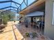 Relax on this large covered patio featuring a tile floor and outdoor seating at 2863 Middleton Cir, Kissimmee, FL 34743