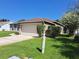 Well-manicured lawn and landscaping accent this single Gathering home with a two car garage at 2863 Middleton Cir, Kissimmee, FL 34743