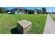 View of neighborhood house with a well-maintained lawn and landscaping at 2863 Middleton Cir, Kissimmee, FL 34743