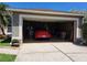 Spacious two-car garage featuring ample storage and an epoxy floor at 2863 Middleton Cir, Kissimmee, FL 34743