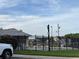 Community pool surrounded by a black iron fence and well-maintained landscaping at 2863 Middleton Cir, Kissimmee, FL 34743