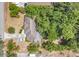 Aerial view showing a house with driveway, roof, green trees and adjacent street at 2918 Croton Rd, Apopka, FL 32703