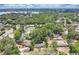 Scenic aerial view of the neighborhood with mature trees and beautiful community lake at 2918 Croton Rd, Apopka, FL 32703