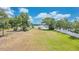 Spacious backyard with lush grass and views of a community gazebo at 2918 Croton Rd, Apopka, FL 32703