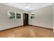 Bedroom with hardwood floors, a ceiling fan, and two windows providing natural light at 2918 Croton Rd, Apopka, FL 32703