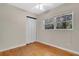 Bedroom with light hardwood floors, a window, and a closet with a white door at 2918 Croton Rd, Apopka, FL 32703