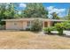 Charming single-story home featuring a well-maintained yard and attached carport at 2918 Croton Rd, Apopka, FL 32703