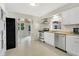 Bright kitchen with stainless steel appliances, white cabinets, and ample counter space at 2918 Croton Rd, Apopka, FL 32703