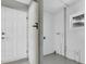 Bright laundry room with white walls, a window, tile floors, and a white entry door at 2918 Croton Rd, Apopka, FL 32703