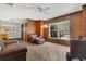 Inviting living area with natural wood paneling, large windows, and comfortable furniture at 2918 Croton Rd, Apopka, FL 32703