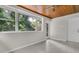 Sunroom with a wooden ceiling, multiple windows, and access to the outdoors at 2918 Croton Rd, Apopka, FL 32703