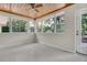 Bright sunroom with wood paneled ceiling, neutral walls, and abundant natural light at 2918 Croton Rd, Apopka, FL 32703