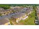 Aerial view of townhome community with dedicated parking and well-maintained landscaping at 318 Australian Way, Davenport, FL 33897