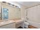 Bathroom featuring a vanity and tub with shower and light fixtures at 318 Australian Way, Davenport, FL 33897