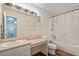 Bright bathroom with a shower-tub combination and plenty of vanity space at 318 Australian Way, Davenport, FL 33897