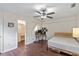 Bedroom featuring a ceiling fan, a bed, and a workspace at 318 Australian Way, Davenport, FL 33897